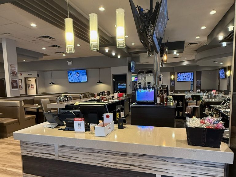 Dining booths and sports lounge interior at Smitty's Pembina at Grant